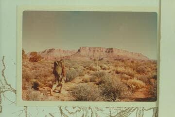 Doctor Tommy Mountain. Harvey Butchart on the trail from Indian Canyon to the rim