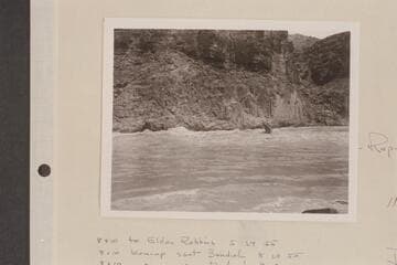 Rod Sanderson pilots the "Twin" through Mile 217 Rapid while Danny Daniels rides the bow. Stage approximates 50,000 cfs