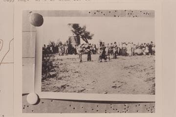 Townfolk of Green River, Utah, to watch the Eddy crew embark June 27, 1927.  Two of the heavy boats copied from the Powell design are at right