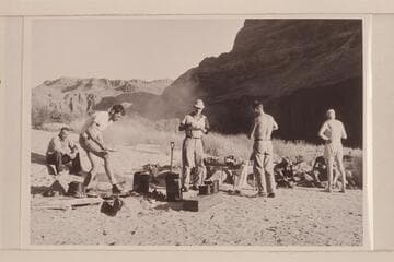 Breakfast at camp at Mile 192. Chet Bundy, Bill Beer, Ballard Atherton, Hugh Cutler and Joe Desloge. Hidden by the standing figures are Josh Eisaman and Chuck Richey