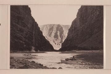 Flying buttresses as seen down river from below Backus Rapid on the left bank. AK Reynolds moves his boat up the beach to camp