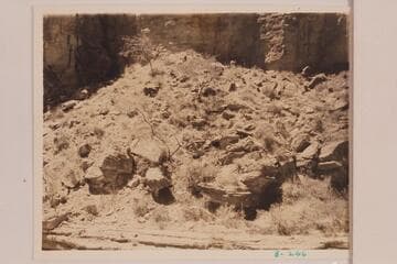 Side of Canyon opposite 3-245 which shows "Noon halt in the shade." At 164 Mile Canyon