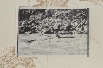 Spectre Canyon Rapid; Les Jones upset.  Note the freed oar