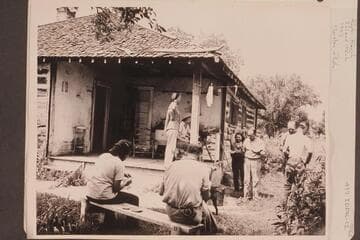 Ruple Ranch; Island Park.  Sitting in foreground are Loel Marston and Willie taylor.  On the porch are Shirley Marston and Rosalind Johnson.  Elma and Al Milotte stand right center.  Norm Nevills stands in front of Joel