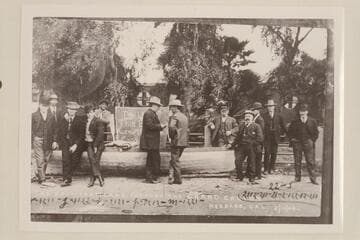 The "Utah" at Needles with Charles Russell at right center explaining how the trip through the Grand Canyon had been accomplished. Ed Monett is third from right