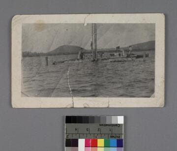 Construction workers driving piles into a lake, Quebec