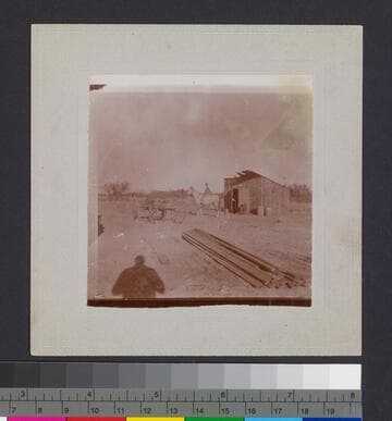 Man on horse with shed