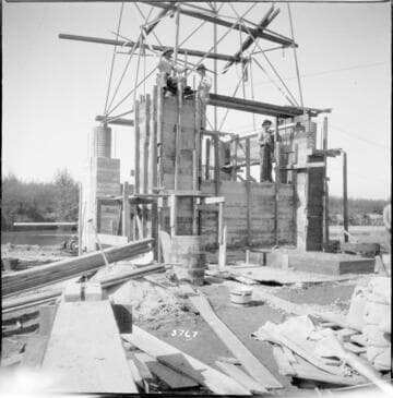 Tower 101 rebuilt with huge concrete base near marsh
