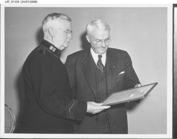 Harry Chandler with a Salvation Army officer