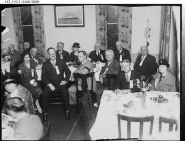 Harry Chandler posed with several others at a dining table