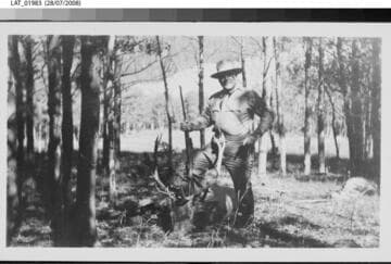 Hunter with dead elk