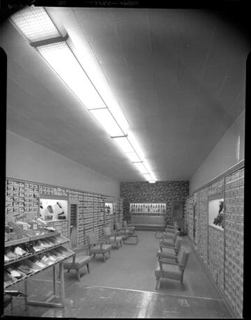 Interior view of a Shoe Store with shoes on display with 1 variant