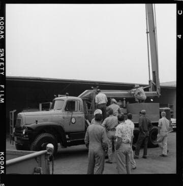 Raising bucket during test at service center