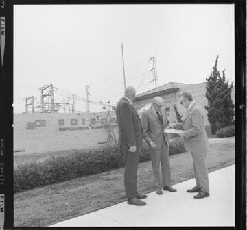 Presentation of certificate or award to VIP in front of Sepulveda Substation