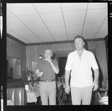 Men eating breakfast in cafe-restaurant