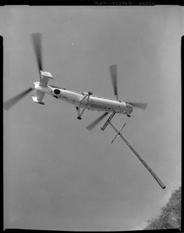 "Sky-crane" helicopter pole placements on remote transmission corridor