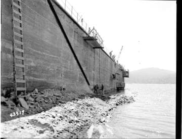 Upstream Protection progress picture at east end of Dam #1. Marginal channel in place along top and extreme east end down to approx. elevation