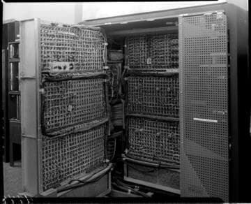 IBM machine opened up exposing mass of wires and circuits