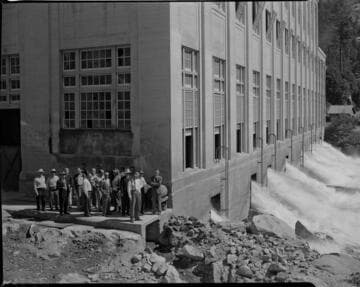 Big Creek Valley Editors Tour: group standing alongside Powerhouse #1 near the tailraces