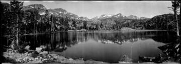 Lake with mountains. approximately 1910