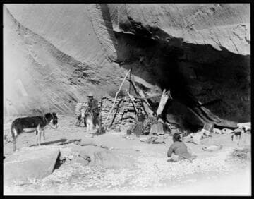 Navajo family living in ancient cliff dwellings, Canyon de Chelly