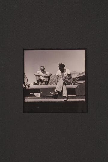 Taylor and Jordan talk it over. End of 1954 Grand Canyon cruise. Gods Pocket on Lake Mead