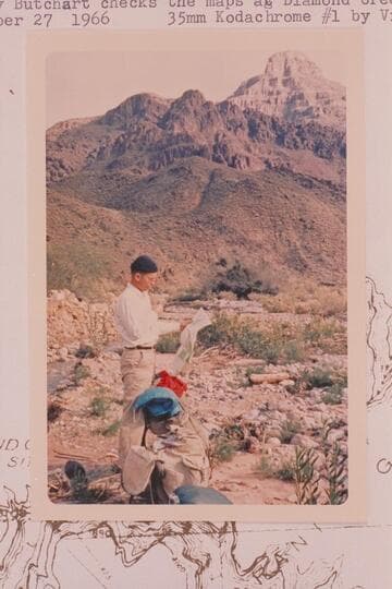 Harvey Butchart checks the maps at Diamond Creek