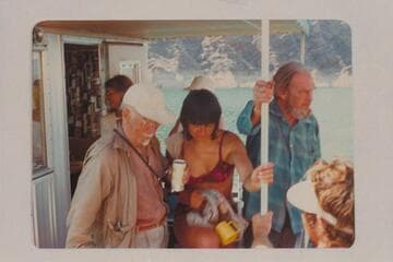 Dock Marston at left and Jim Jordan at right on Jim's houseboat on Lake Mead. The middle figure is one of the Grand Canyon Expedition party and probably Mrs. Pierce