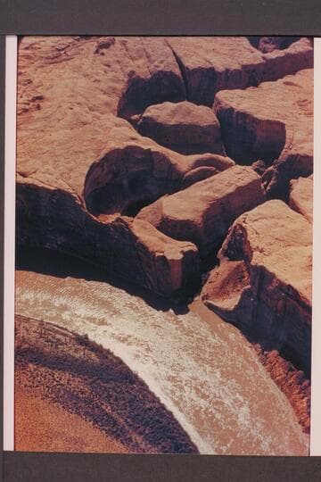 Side canyon in Glen Canyon at Mile 34.4; left bank. Approx. gauge: 31,000 cfs