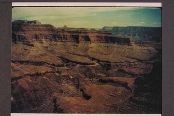 Up the canyon from on or near the Bass Trail.  Similar terrain to view on page 196 of Holmes, which is captioned "From the Grand Scenic Divide."