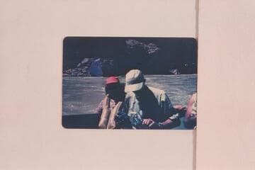 Evie and John Mull at end of motor run of 1952, May.  John winds his camera with pliers