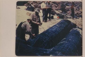Beginning repairs on the wounded boloney "Millipede."  Hatch party traversing Grand Canyon