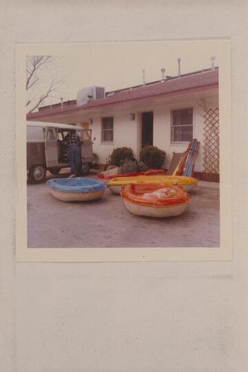 Bill Belknap unloading Sportyaks and gear from the Volkswagon.  Moab, Utah