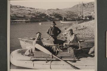 Amos Burg; Willis Johnson; and Buzz Holmstrom with the two boats upon their arrival at Lake Mead