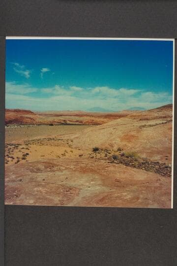 Slick rock roadway out of Halls Crossing on left bank