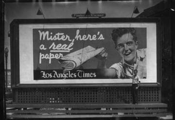 Ed Whittington and a billboard for the Los Angeles Times. 1935