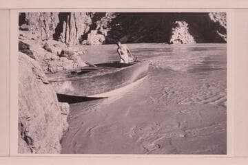 Harry Aleson in the "Up Colorado" at the right bank a few miles above Bridge Canyon