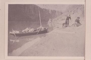 Galloway and Knox at camp in Glen Canyon.  The boat was borrowed from the Hoskaninni Mining Company near Hite and used for the run to Lees Ferry.  After reaching Lees Ferry on Thanksgiving, the trio walked to Flagstaff