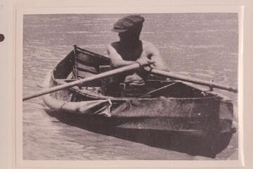 Frank Dodge in the folding canvas boat "Mojave" as the USGS 1923 party left Lees Ferry. The boat was wrecked while lining Cave Springs Rapid