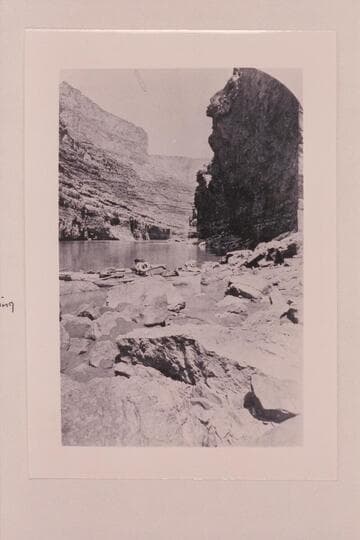 Marble Canyon? Wall of Limestone. Note 2 boats. Two ring preservers hanging on the throne