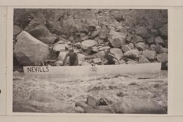 Nevills and Bell work the 16 foot punt down the shore; San Juan River
