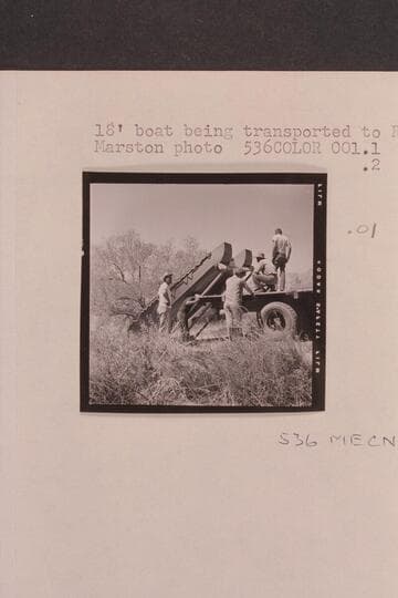 18 foot boat being transported to river by: Claude, Rod, Dick, Vern and Jack