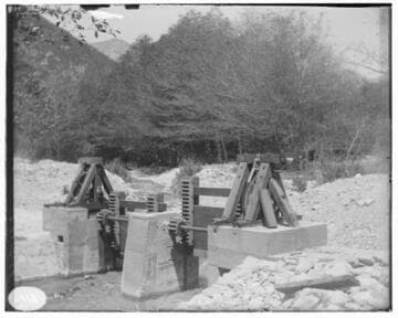 A close-up of sluice gates at Lytle Creek headworks, showing the mountains in the background