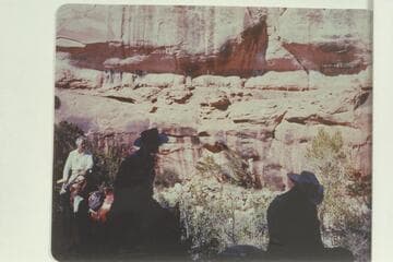 Trail on the ledge of Bridge Canyon. John Doerr, at left, is riding the new trail on the other side of the canyon