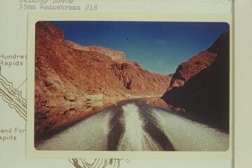 Downriver from Mile 238. The cook house of Bridge Canyon City is below the side canyon at left bank