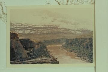 Down from Mile 216.7 showing snow on the cliffs. 217 Mile Canyon can be seen above point where the river disappears