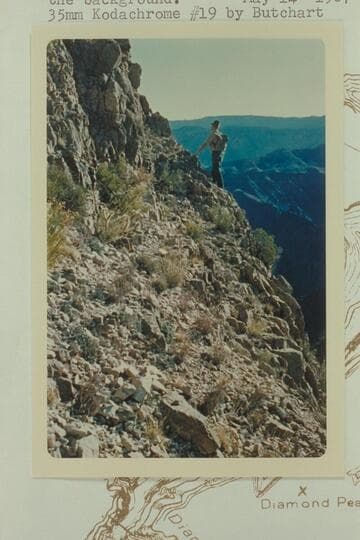 The looking for the route to the top of Diamond Peak. The terrain back of the left bank up from Mile 224 is in the background