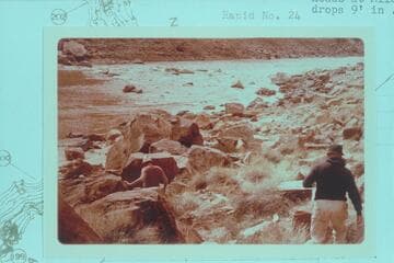 Bill Belknap and Dock move down to camp at Mile 202.25. The rapid is No. 23 which heads at Mile 202.20 and drops 9 ft. in .15 miles