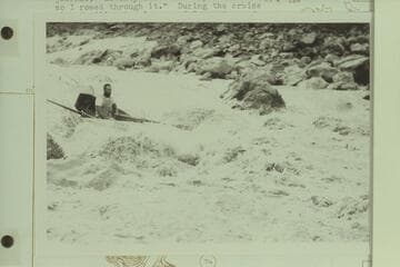 Barry Goldwater pushing a Nevills sadiron through a rapid