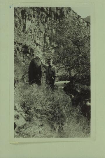 Blake and cactus. Tapeats Creek in background, just above box canyon of Tapeats Creek and not far from the river